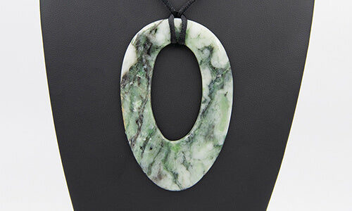 Oval shaped California River Blossom Jade pendant beautiful green patterns