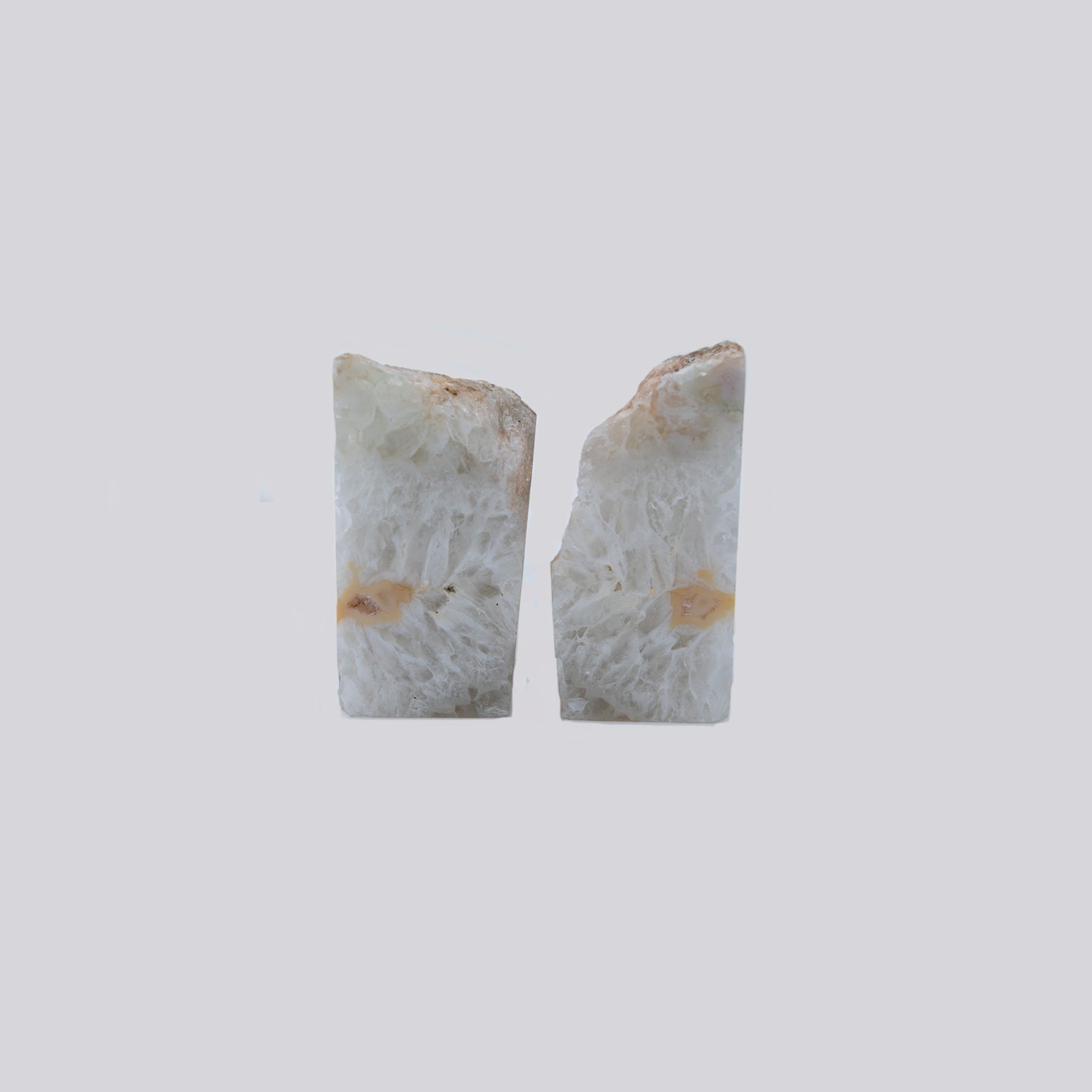 Quartz Starburst Bookends.  Gorgeous set of bookends with a wild starburst Quartz and clear Agate pattern within.  These were sourced in Brazil.  Set measures 4 inches tall by 4.5 inches wide.