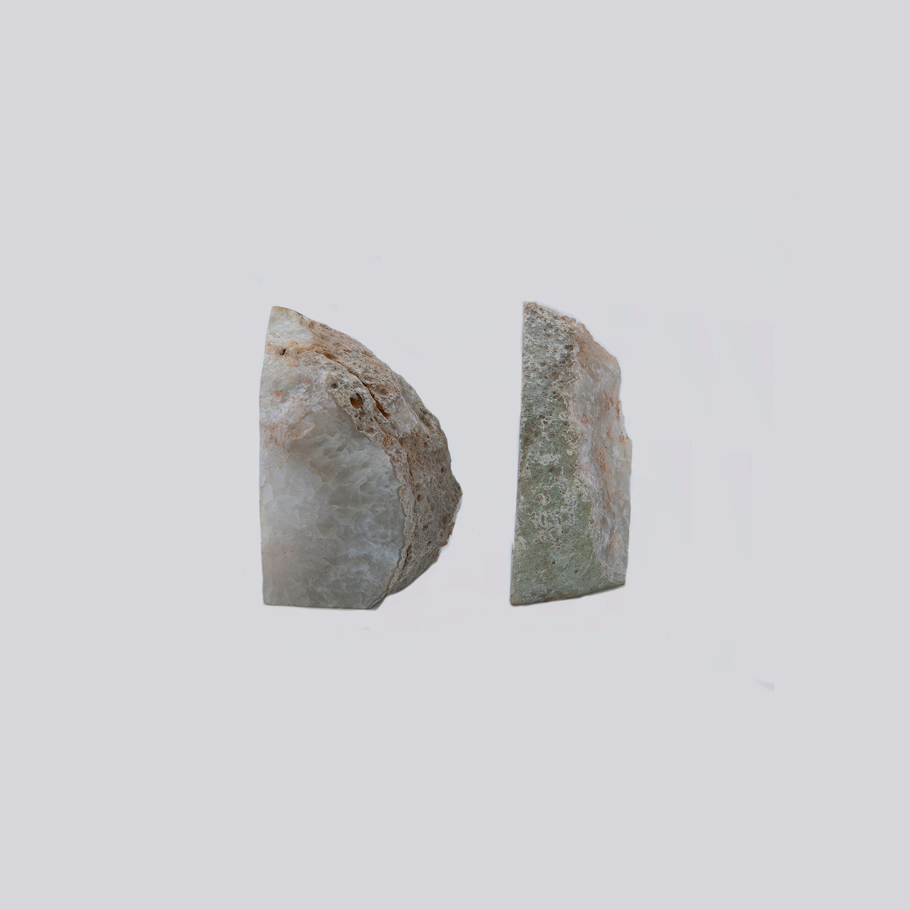 Quartz Starburst Bookends.  Gorgeous set of bookends with a wild starburst Quartz and clear Agate pattern within.  These were sourced in Brazil.  Set measures 4 inches tall by 4.5 inches wide.