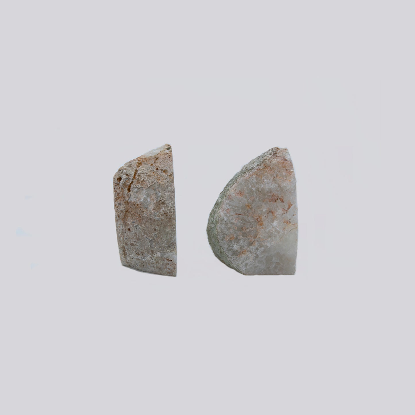 Quartz Starburst Bookends. Gorgeous set of bookends with a wild starburst Quartz and clear Agate pattern within. These were sourced in Brazil. Set measures 4 inches tall by 4.5 inches wide.
