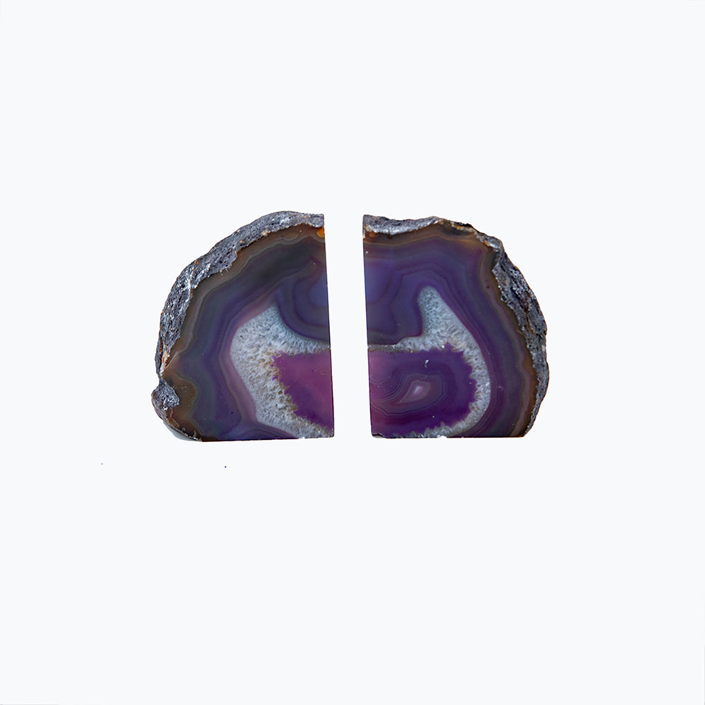 Brazilian Agate Bookends. Beautifully figured Agate bookends. Size 7 inches wide and 4 inches high. Purple color has been added.