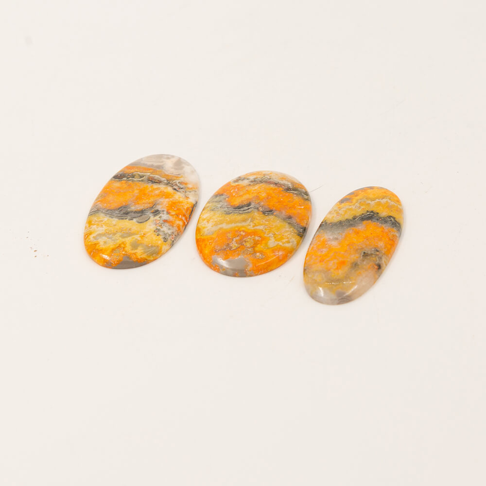 Bumble Bee Jasper is a rare stone from only one spot on earth.  Brilliant yellow with gray and white bands.  Sourced on the Isle of Java so we could sell the finest in color and pattern. Approximately 2 inch cabs.