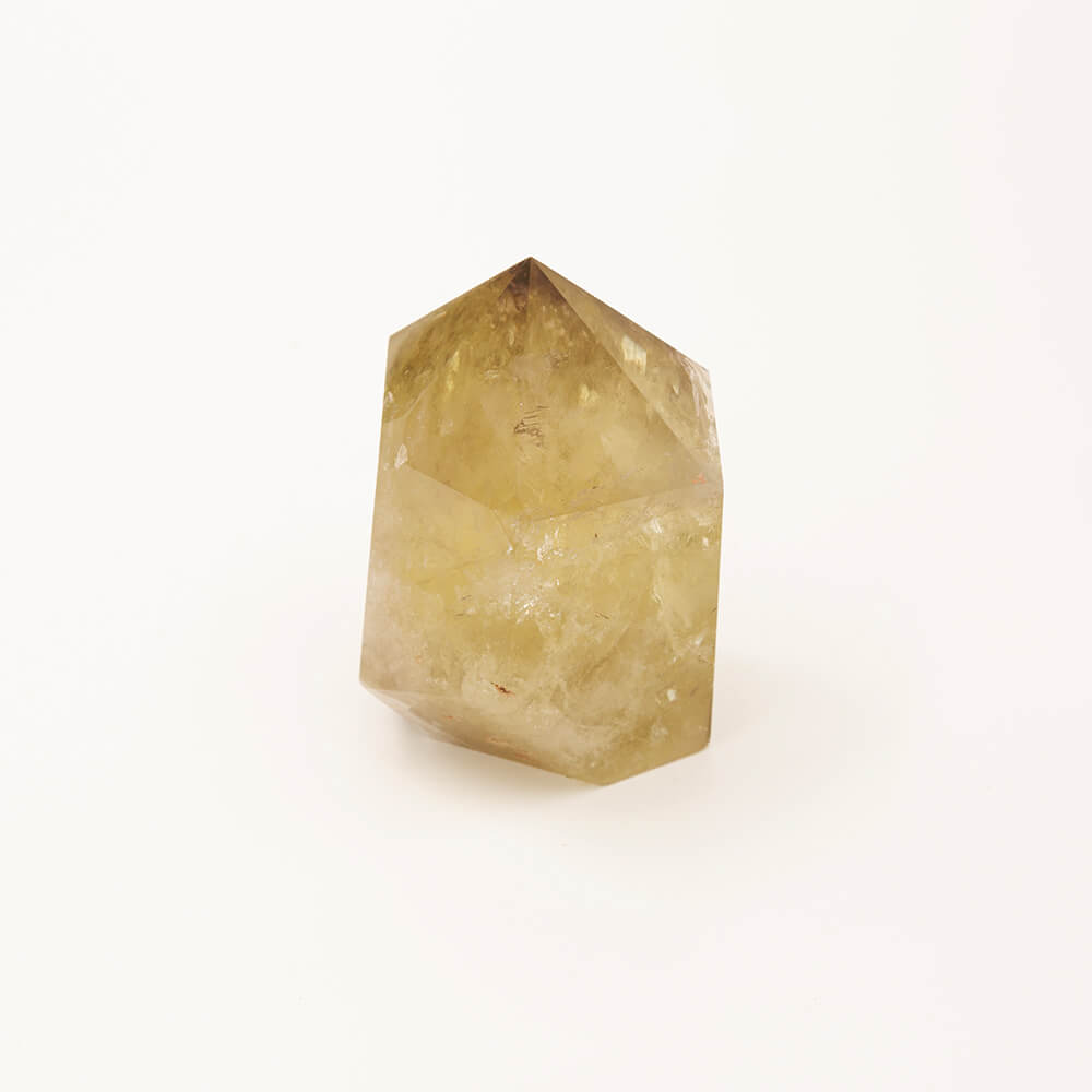 A lovely large Citrine crystal point with greenish hue. Size: 4.75x3.5x3in.