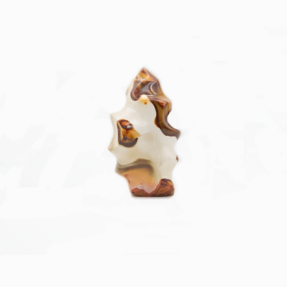 Fine Imperial Jasper hand carved into flame spiral shape. Varied colors and patterns make this a super interesting piece. Over 5 inches tall, over 2.5 inches wide and almost 2 inches deep.