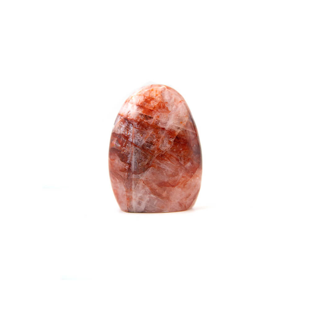 Carnelian stand up stone. Nice polish with interesting inclusions of cream color accenting the red and orange. Size approximately 3x2.5x1 inches. Carnelian is said to enhance creativity of ideas and plans. It is supposed to bring new energy into one's mind and expel old ideas and habits that are no longer useful.