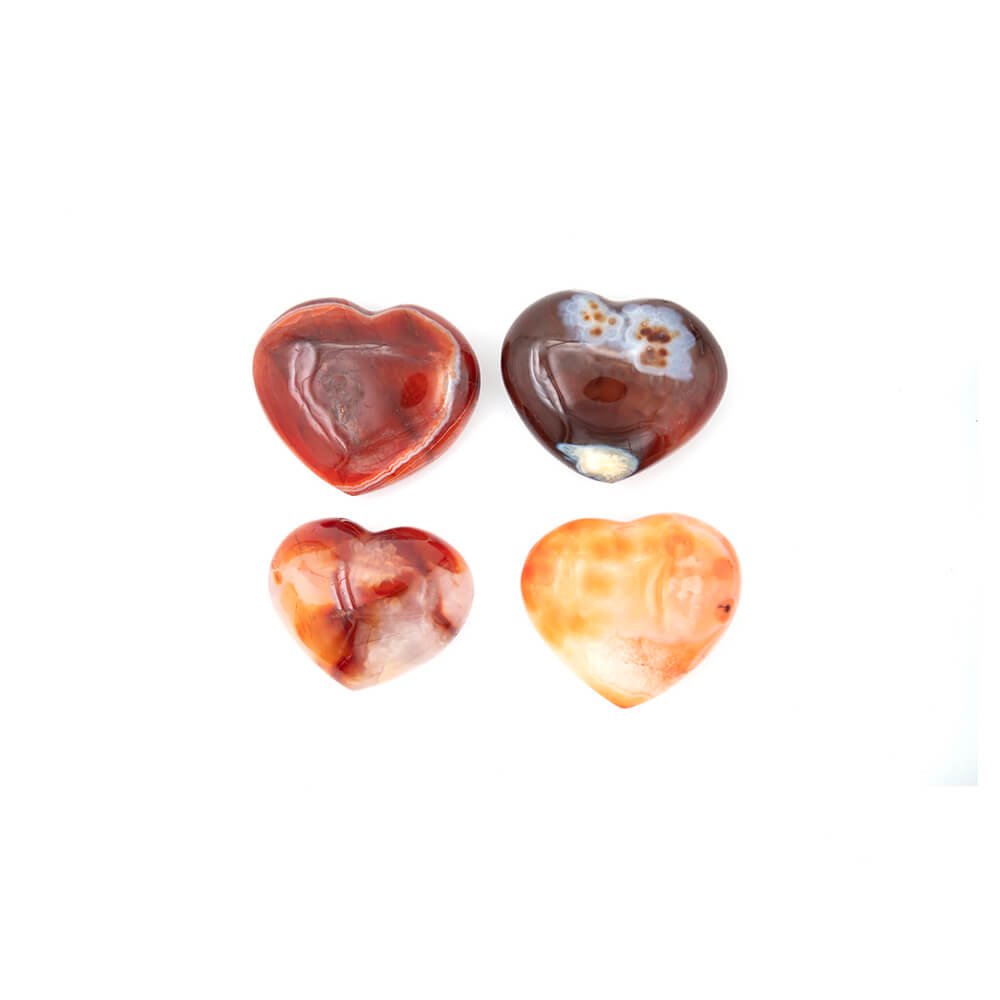 Lustrous Carnelian Hearts. Size approximately 2.5x2x.5 inches. Incredible rich colors of reds and oranges with creamy accents. Carnelian is said to enhance creativity of ideas and plans, bringing new energy into one's mind and expelling old ideas and habits that are no longer useful.