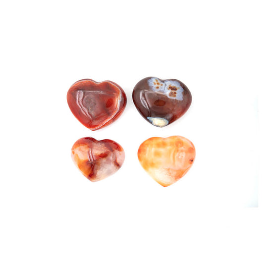 Lustrous Carnelian Hearts.  Size approximately 2.5x2x.5 inches. Incredible rich colors of reds and oranges with creamy accents. Carnelian is said to enhance creativity of ideas and plans, bringing new energy into one's mind and expelling old ideas and habits that are no longer useful.