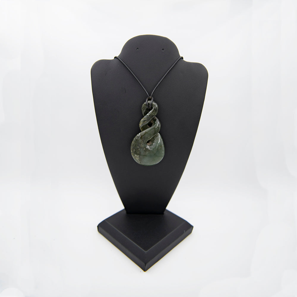 A Large piece carved of rare California undersea Jade! This was purchased from an Artisan at the Big Sur Jade Festival years ago. I found it wedged in the bottom of an old show box recently so now it is for sale. Very nice Blueish green piece from the only undersea Jade deposit known. Has some translucent features and very smooth polish. 3x1.5 inches