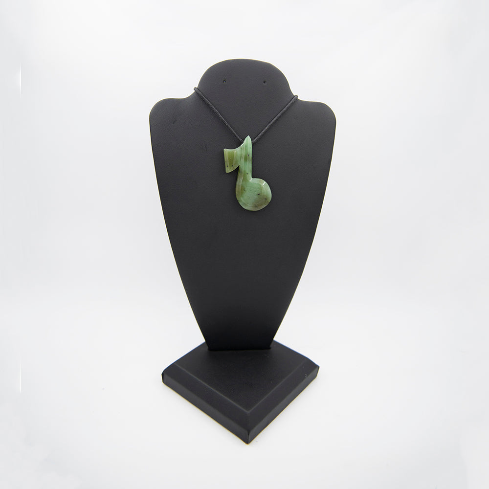 Siberian Jade Musical Note Pendant. Another piece carved by a local Oregon carver. Carved from Polar Jade. Polar Jade is known as the hardest and greenest jade in North America. Sourced on Polar Mountain, British Columbia. Size: just over 2 inches in height and a little over 1 inch in diameter.
