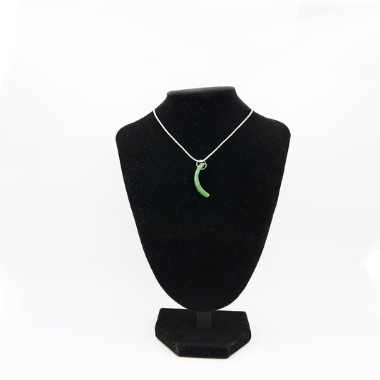 Polar Jade Tomoe Pendant.  The finest Polar Jade was used in this ancient Japanese Tomoe symbol often associated with the Samurai.   This picture is of the exact piece you will receive. It is an inch and a half in size.