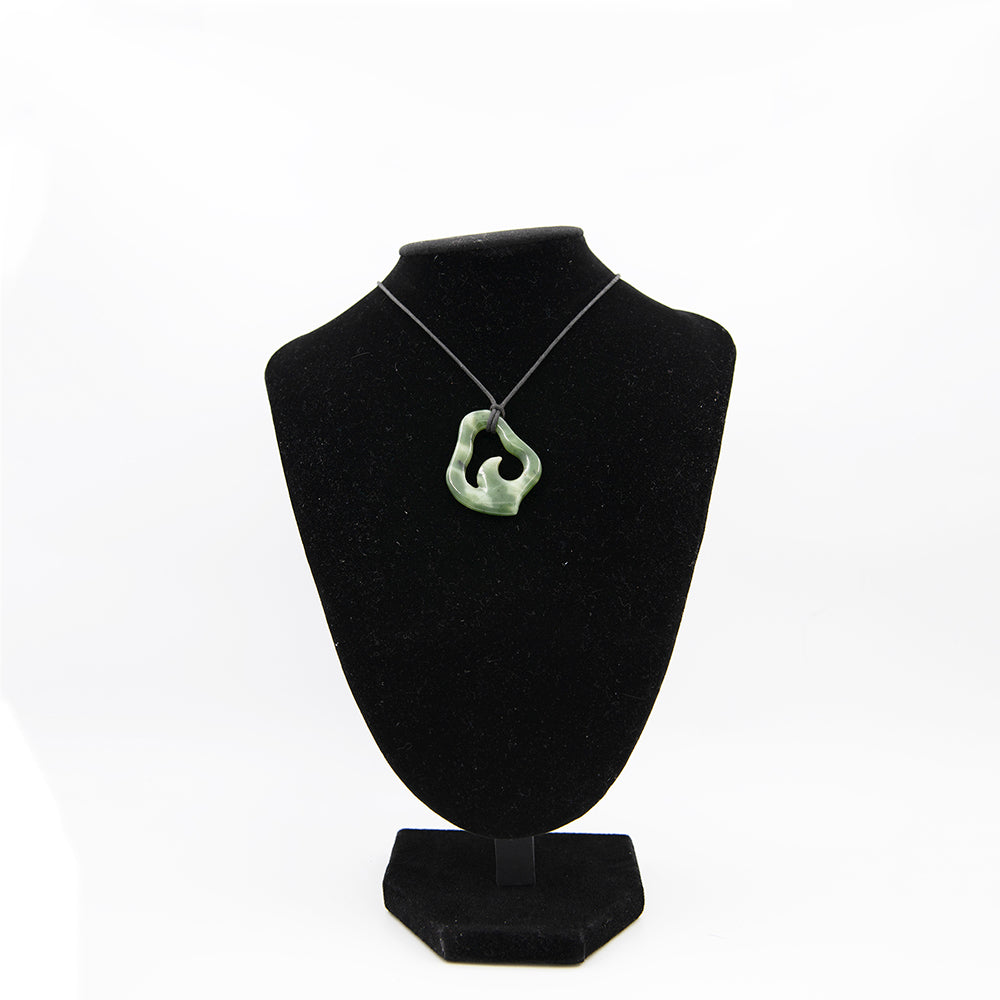 British Columbia Jade Seagull Pendant.  Handcrafted design in beautiful multicolored greens and whites. Approx 1 1/4 high by 1 1/8 wide.