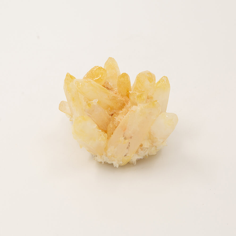 A fine golden Quartz cluster. Size: 3.25x3.25x2.75 inches. Said to be a crystal of healing. Beautiful pale golden color.