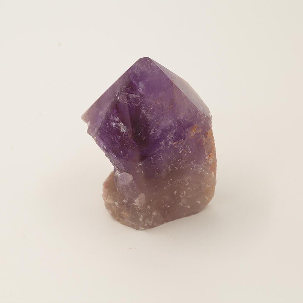 Nice Purple Amethyst point.  Size: 4.25x3.25x2.25.  Beautiful, varied colors.
