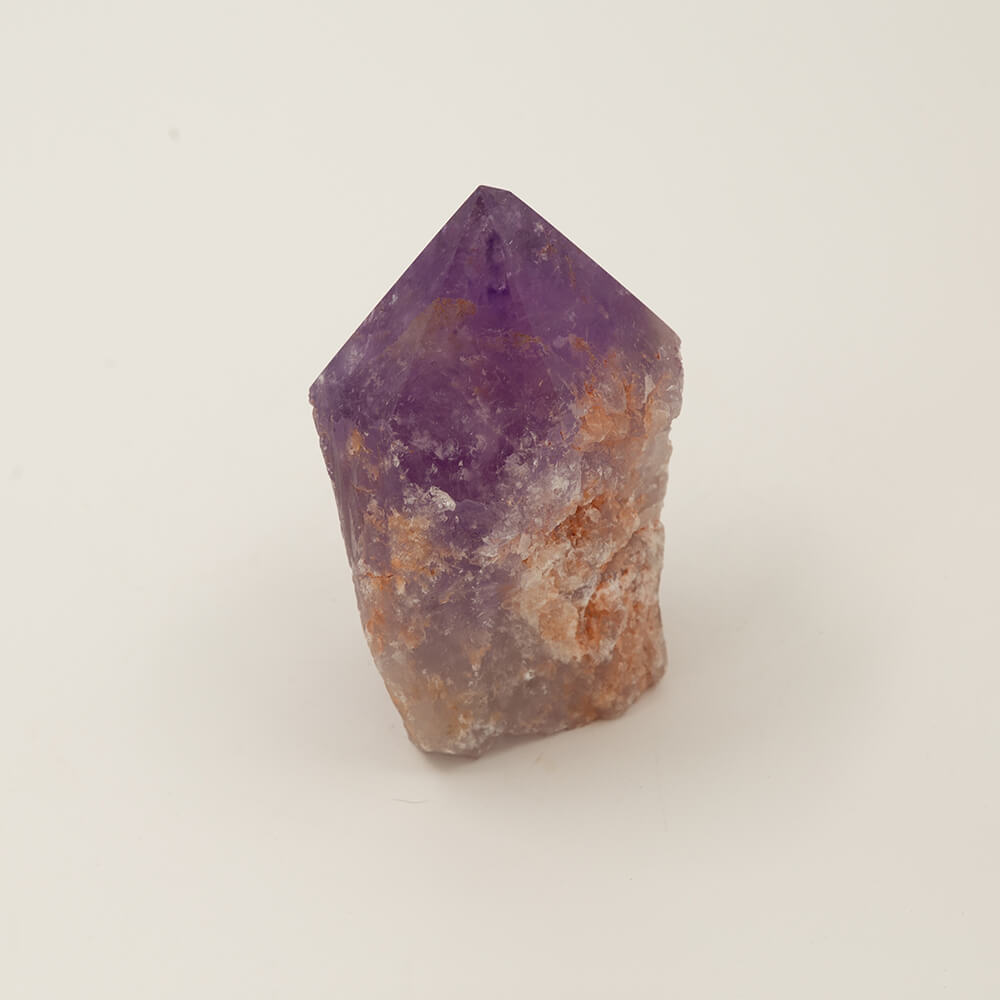 Nice Purple Amethyst point.  Size: 4.25x3.25x2.25.  Beautiful, varied colors.