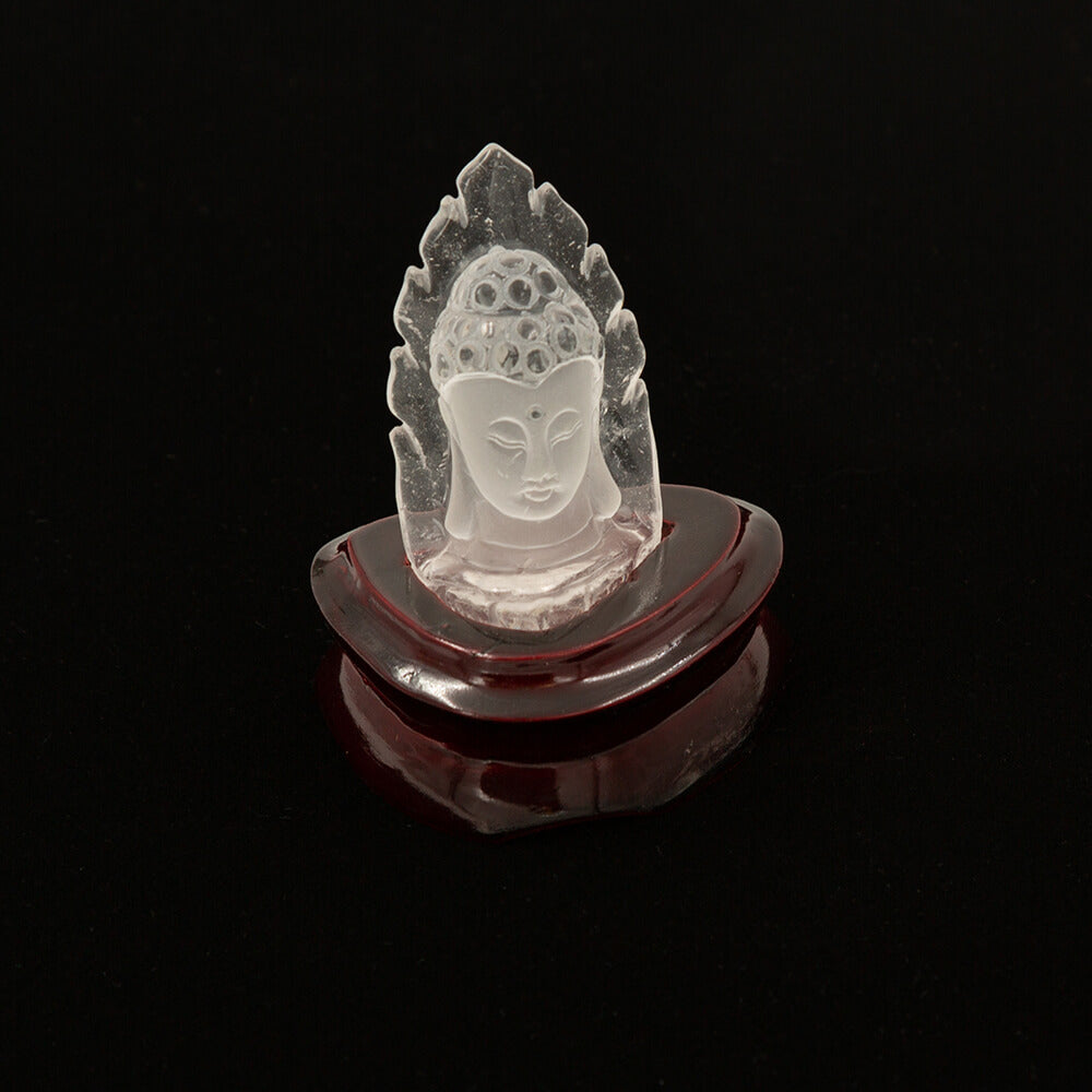 A spectacular carving of a Kwan Yin from high quality translucent quartz. Approximately 3 inches high on a polished stand.