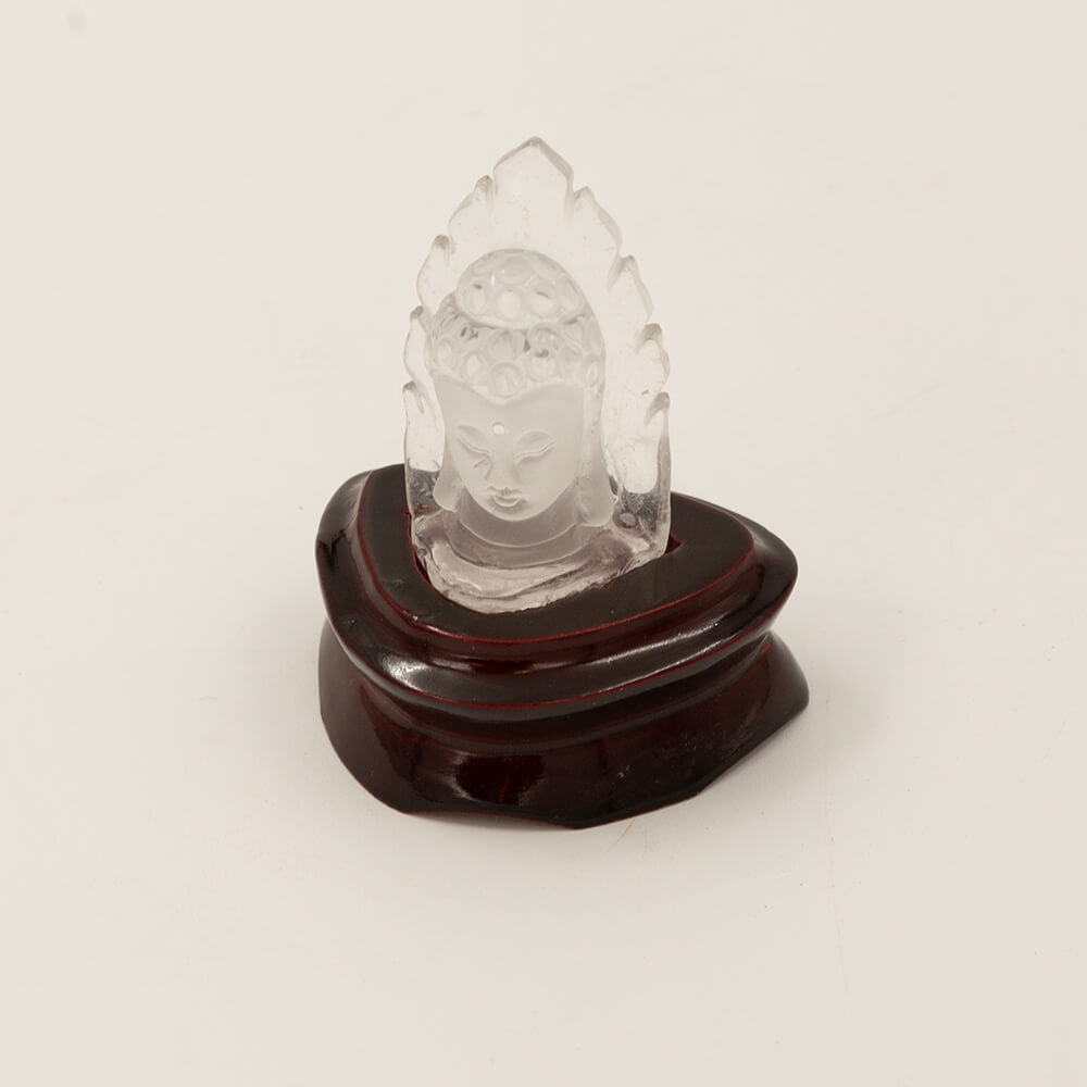 A spectacular carving of a Kwan Yin from high quality translucent quartz. Approximately 3 inches high on a polished stand.