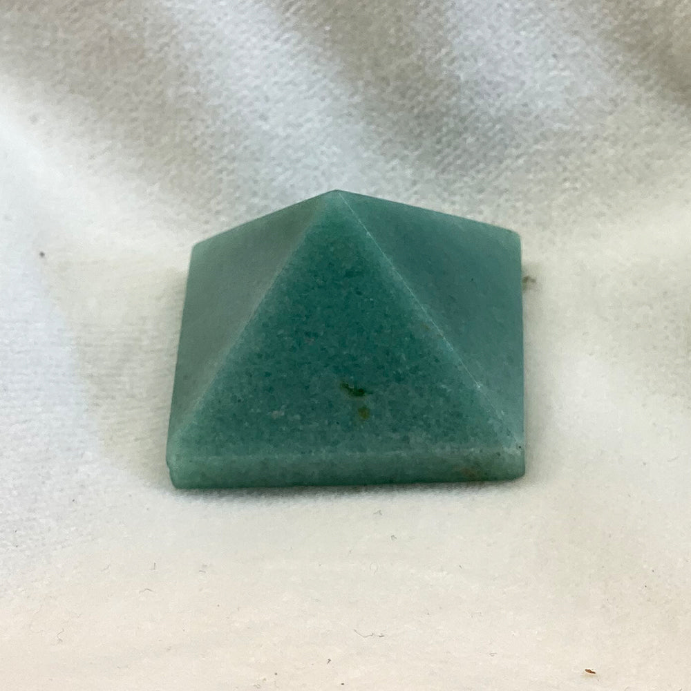Aventurine pyramid. Pale green in color, smooth polish. 1 inch+ on each side of the base.