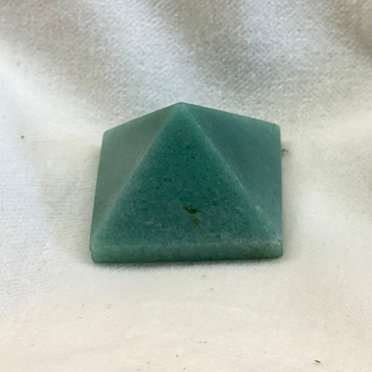Aventurine pyramid.  Pale green in color, smooth polish.  1 inch+ on each side of the base.