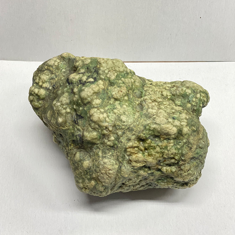 California Botryoidal RiverBlossom Jade Rock. Super bumpy features all over! White Jade bots in a pleasing green matrix. 5x4x2.5 inches. Sourced from our helicopter trips to the North fork of the Eel River, California.