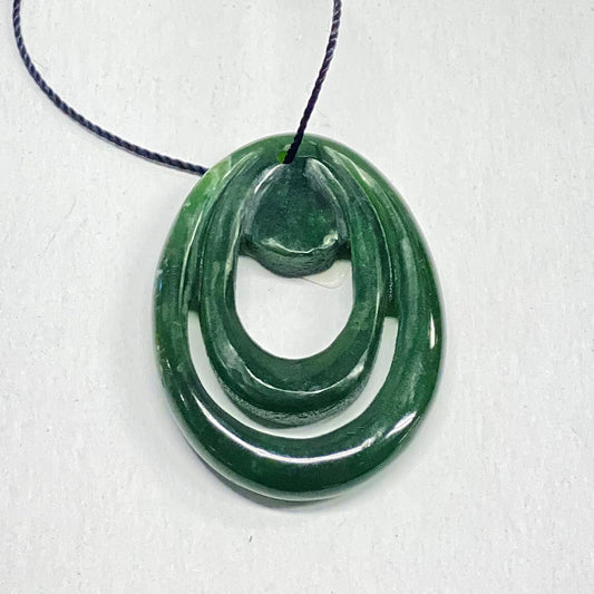 Fine British Columbia Jade Pendant.  Beautiful green color.  Superb polish and design in this hand carved pendant. Traded for this with a traveling artist that does excellent work.