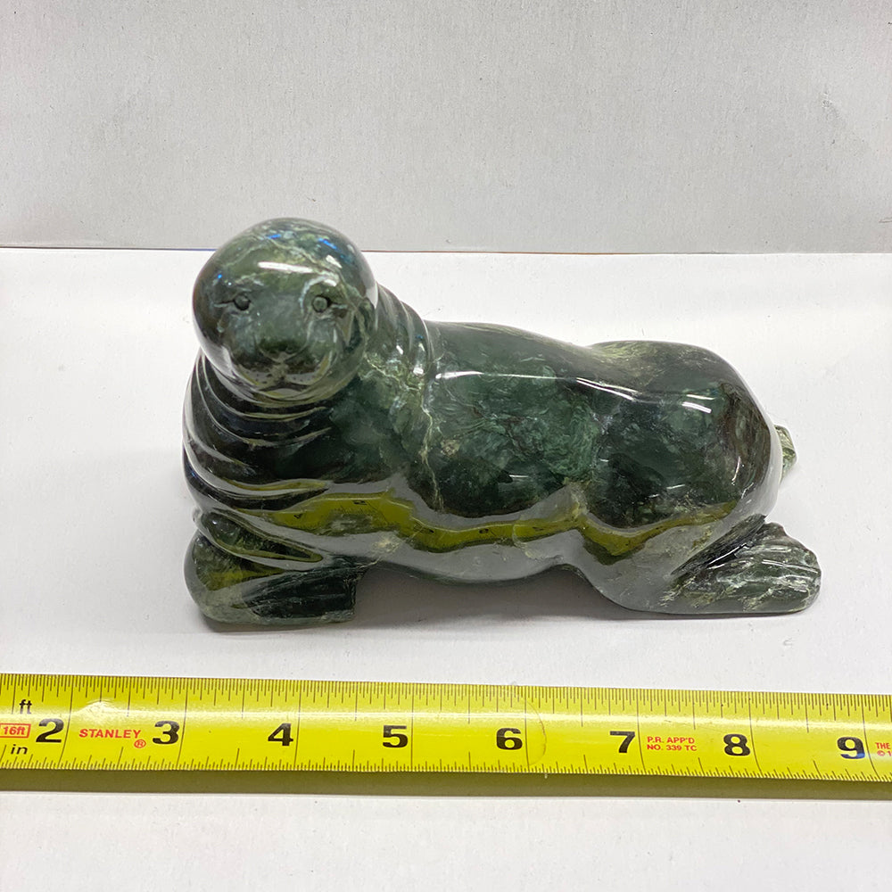 Handcrafted Mendocino Jade Seal Carving. Nice Jade. Smooth finish and polish. A nice representation of local Mendocino ocean life. The jade used in this one of a kind piece was sourced from our helicopter trips to our mining claims in the Leech Lake Mountain area in Mendocino County, California. That area has since been declared "Wilderness Area," our claims are no longer valid and we can no longer gather jade there. The pictured piece is exactly the piece you will receive.