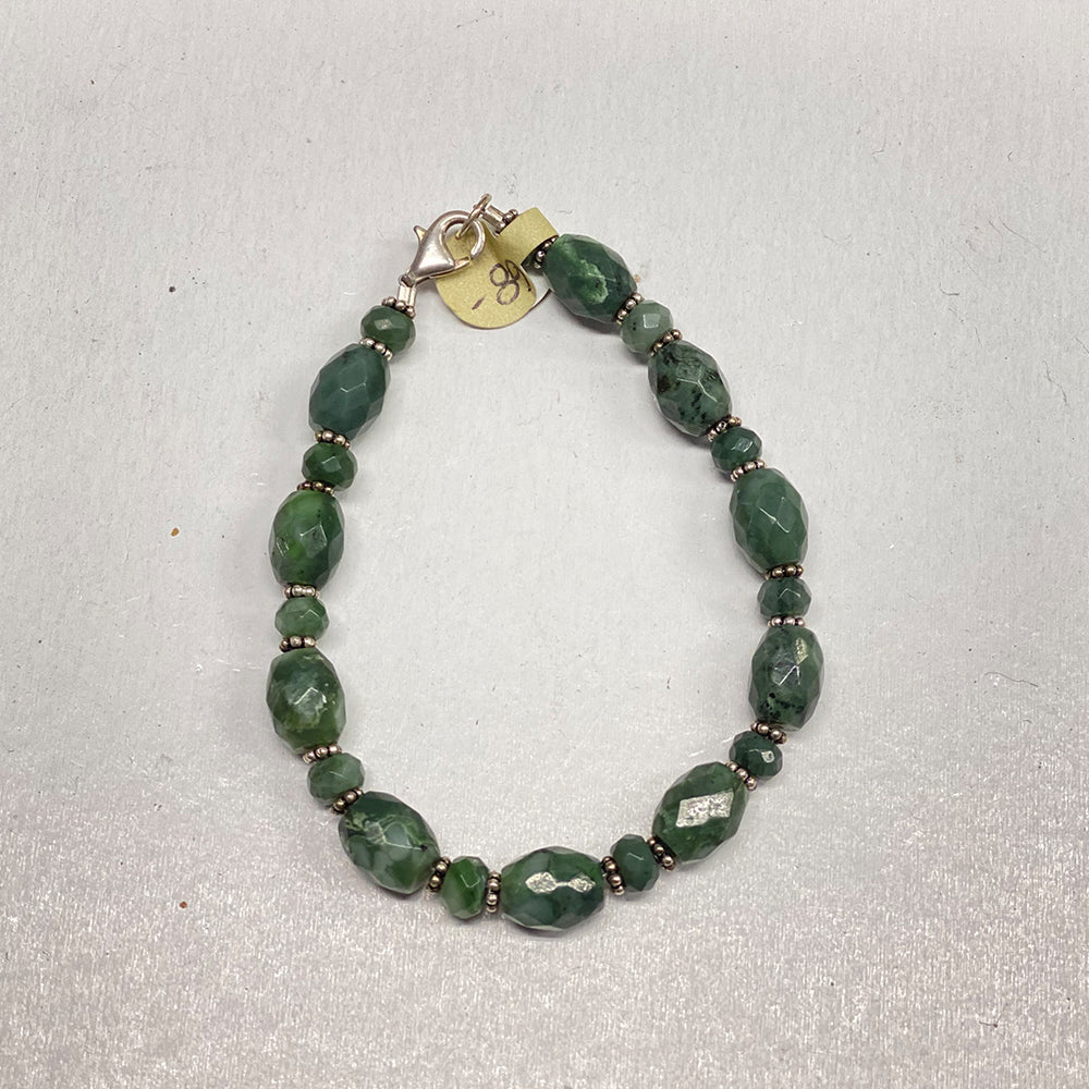 Mendocino California Faceted Jade Bracelet. 7.5 inches of forest green jade sourced in Covelo, Mendocino County California. Sterling silver accent beads and lobster clasp.