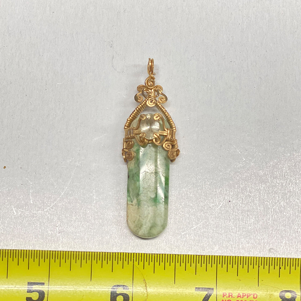 RiverBlossom Jade and Sunstone Pendant. Heavy gold filled wire with a prong set, faceted Oregon Sunstone. One of a kind.