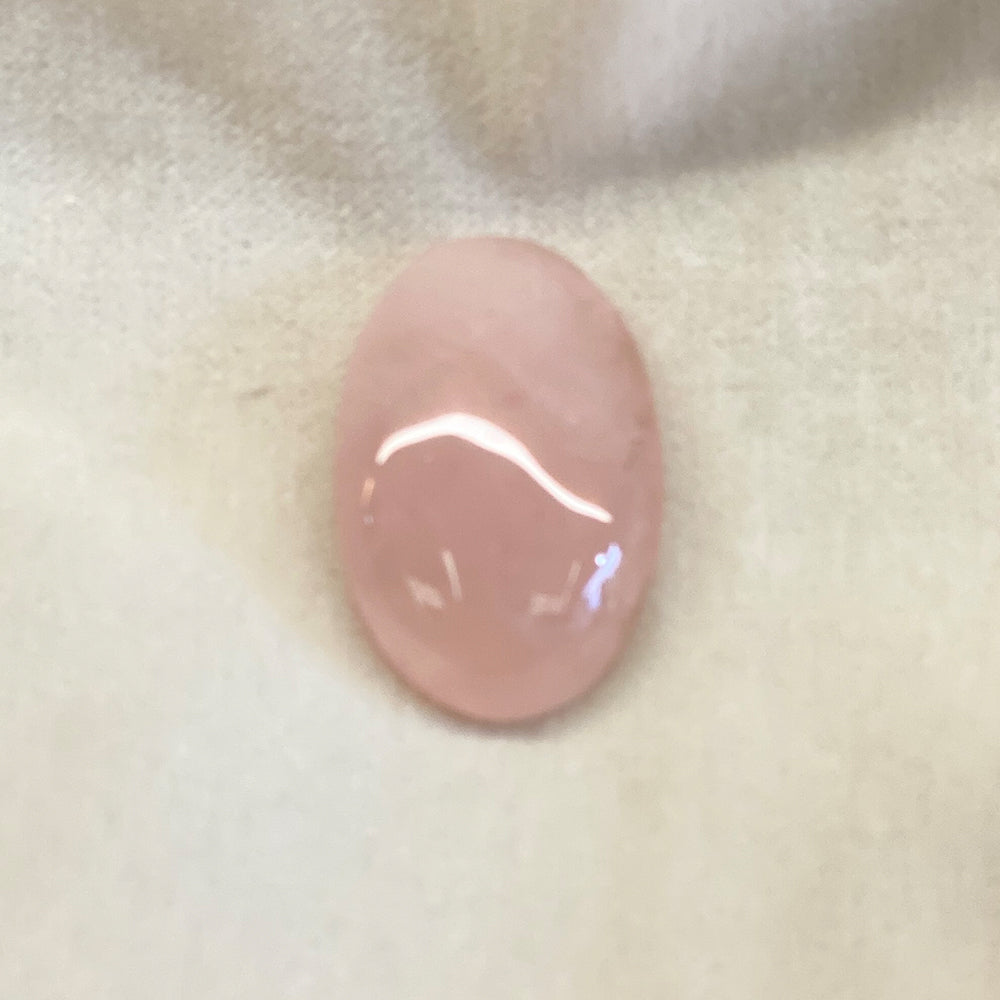 Rose Quartz Cabochons. Pink translucent stone. Smooth oval shape with curved face. Size approx: 1+ in. Rose Quartz lore says it is a stone that will attract love.