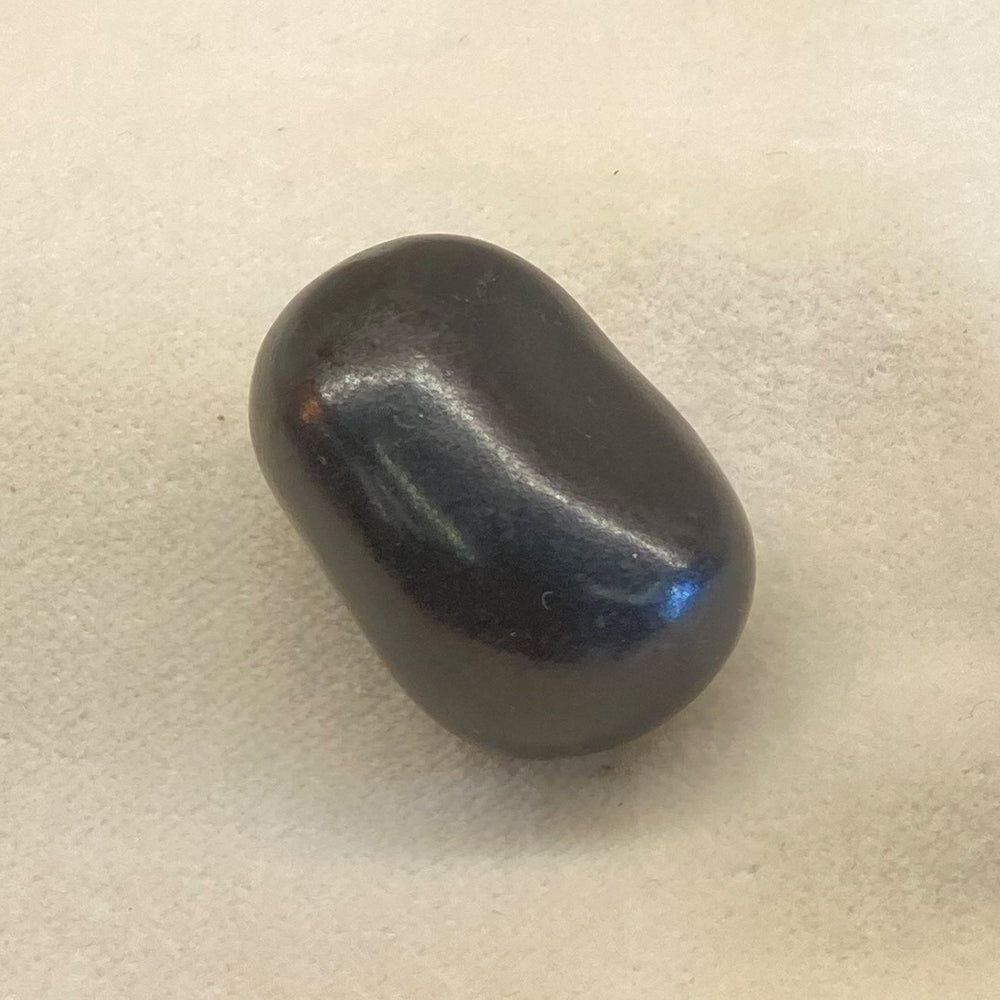 Shungite Polished Pebbles. Matte-black, smooth surface and edges. Approx. one inch in size. Shungite is known by metaphysical practitioners for personal protection from EMF and all bad energy.