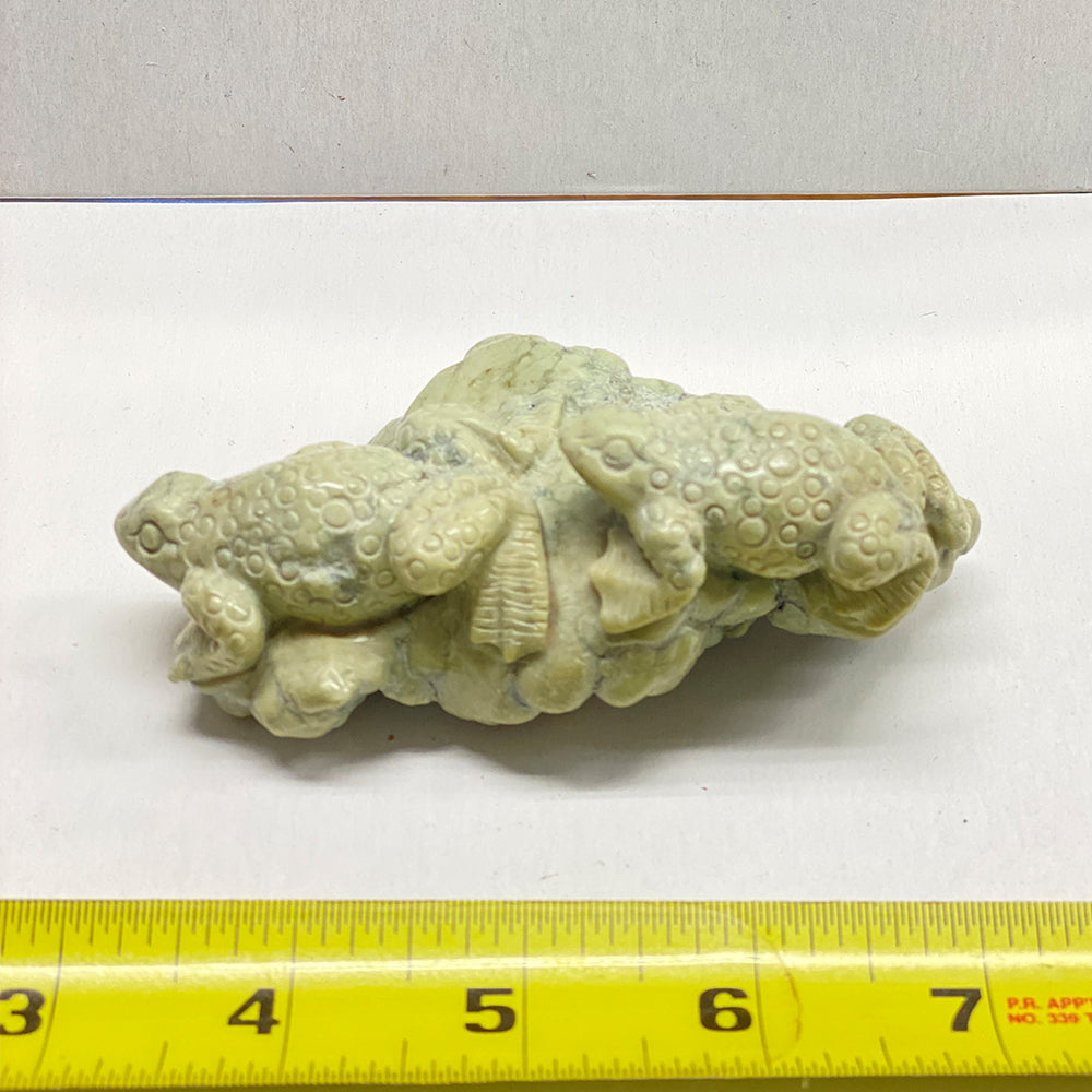 No other carving like this one! A beautiful rare Botryoidal Jade with one side carved into two frogs and the other with natural botryoidal bubbles. The jade used in this piece was sourced from our helicopter trips to our private property in the Trinity Alps area in California. We call this "RiverBlossom Jade," as the winter storms create high water that delivers the Jade for us to simply pick up as the water recedes in the summer.