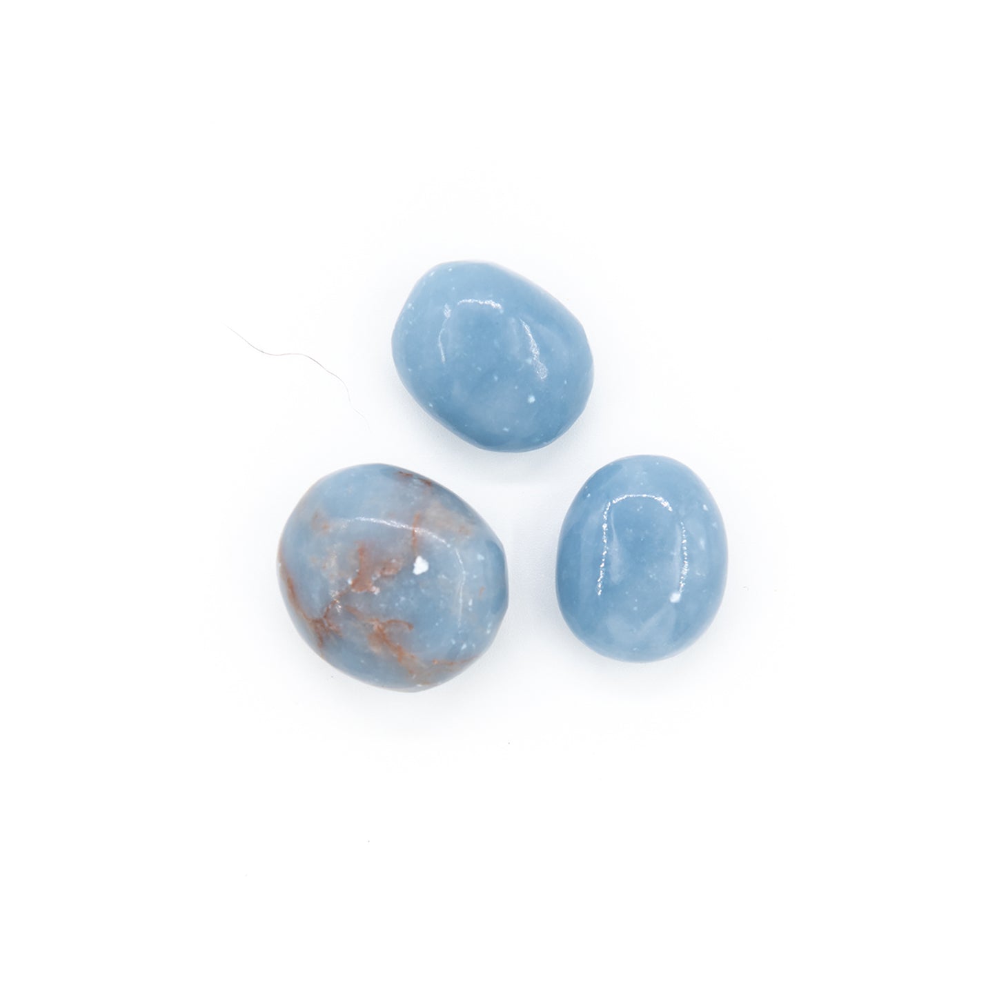 Blue opaque Angelite pebbles. Light sky blue and smoothly polished for pocket carrying.