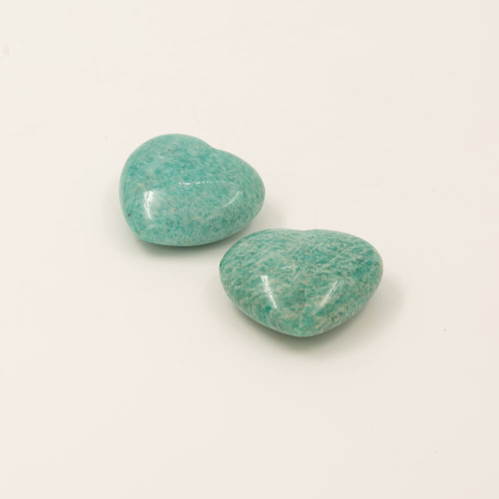 Beautiful polish, patterns and color are featured on these really nice Amazonite hearts.