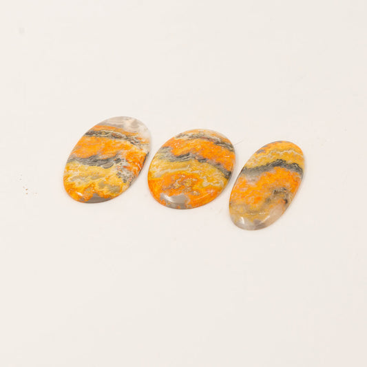 Bumble Bee Jasper is a rare stone from only one spot on earth.  Brilliant yellow with gray and white bands.  Sourced on the Isle of Java so we could sell the finest in color and pattern. Approximately 2 inch cabs.