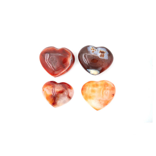 Lustrous Carnelian Hearts.  Size approximately 2.5x2x.5 inches. Incredible rich colors of reds and oranges with creamy accents. Carnelian is said to enhance creativity of ideas and plans, bringing new energy into one's mind and expelling old ideas and habits that are no longer useful. 