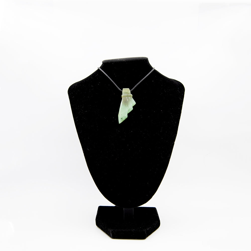 Siberian Jade Feather Fleur-de-lis Pendant.  Translucent Jade from sea green to olive green in color with perfect workmanship.  Fleur-de-lis pattern.  Many say it looks like a feather also.  Size: approx. 2 inch by 1 inch.   One of a kind.