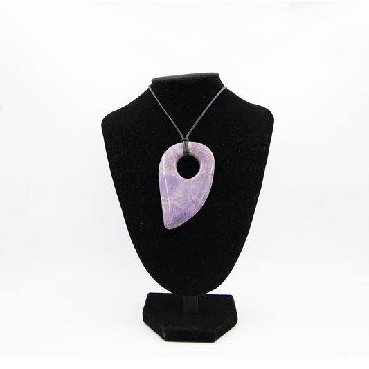 Purple Jadeite Large Stylized Adze Pendant.Beautiful color and shape. Purple Jadeite is always a statement and that statement is enhanced by the size, workmanship and shape of this beauty. Over 3 inches long by 2 inches wide.  One of a kind.
