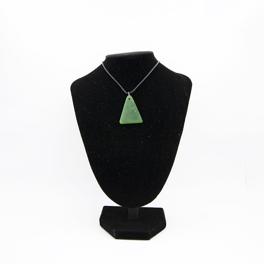 Polar Mountain Jade Triangle Pendant.  Polar Mountain, Canada Jade is known as the hardest and greenest Jade in North America.  Size: approximately 1.5 x 1.25 inches