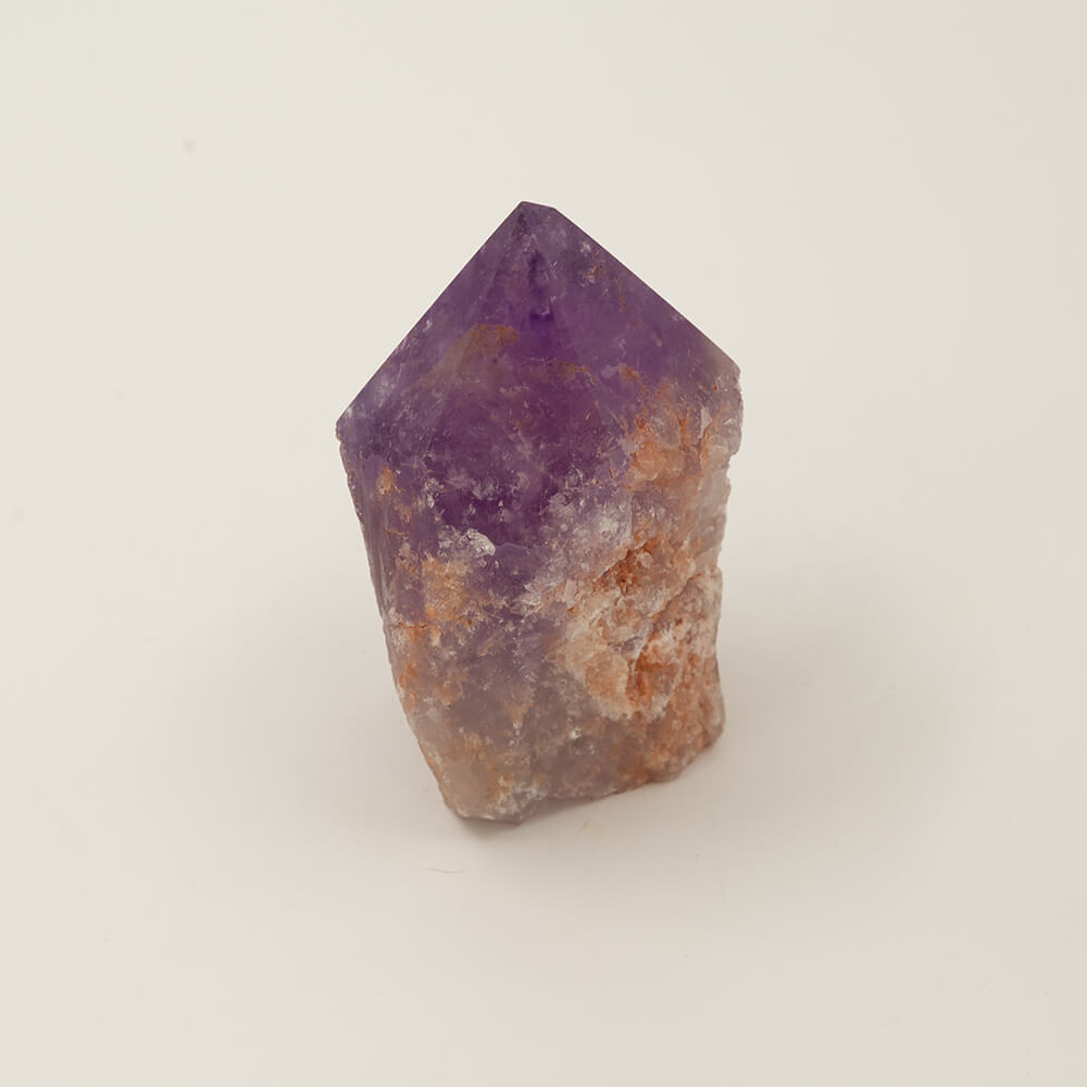 Nice Purple Amethyst point.  Size: 4.25x3.25x2.25.  Beautiful, varied colors. 