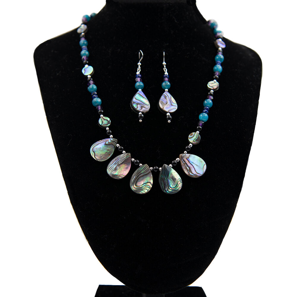 Made in Mendocino, California, this abalone necklace and earring set includes beads of Beautiful Abalone, Blue Apatite, Purple Amethyst, Black Onyx and Sterling Silver with Sterling ear wires. A bit over 16 inches long. Earrings are 1 3/4 inches long.
