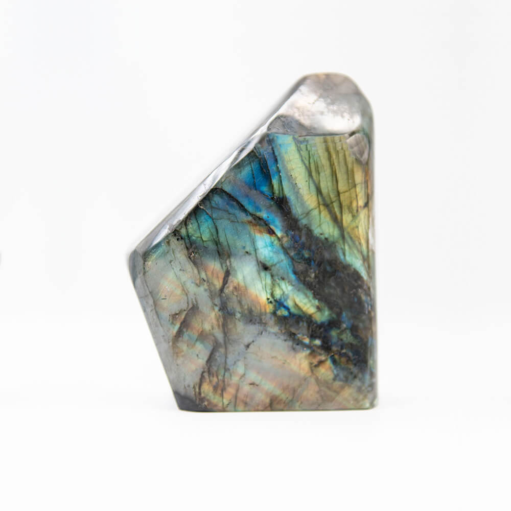 The very best quality Labradorite. Both sides are iridescent everywhere. They just don't get better than this display piece from Madagascar. Almost 7 inches tall, 5 inches wide, over 2 inches thick and weighing close to 5 pounds.