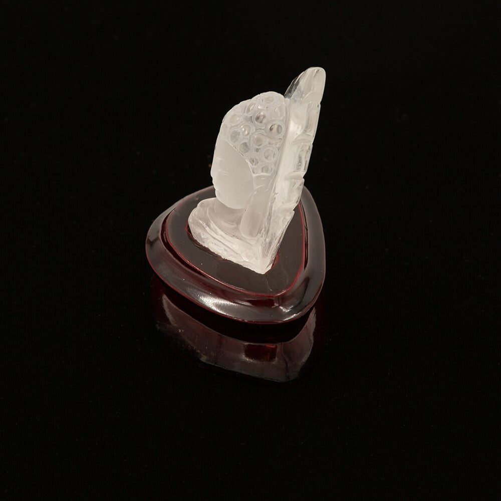 A spectacular carving of a Kwan Yin from high quality translucent quartz. Approximately 3 inches high on a polished stand.