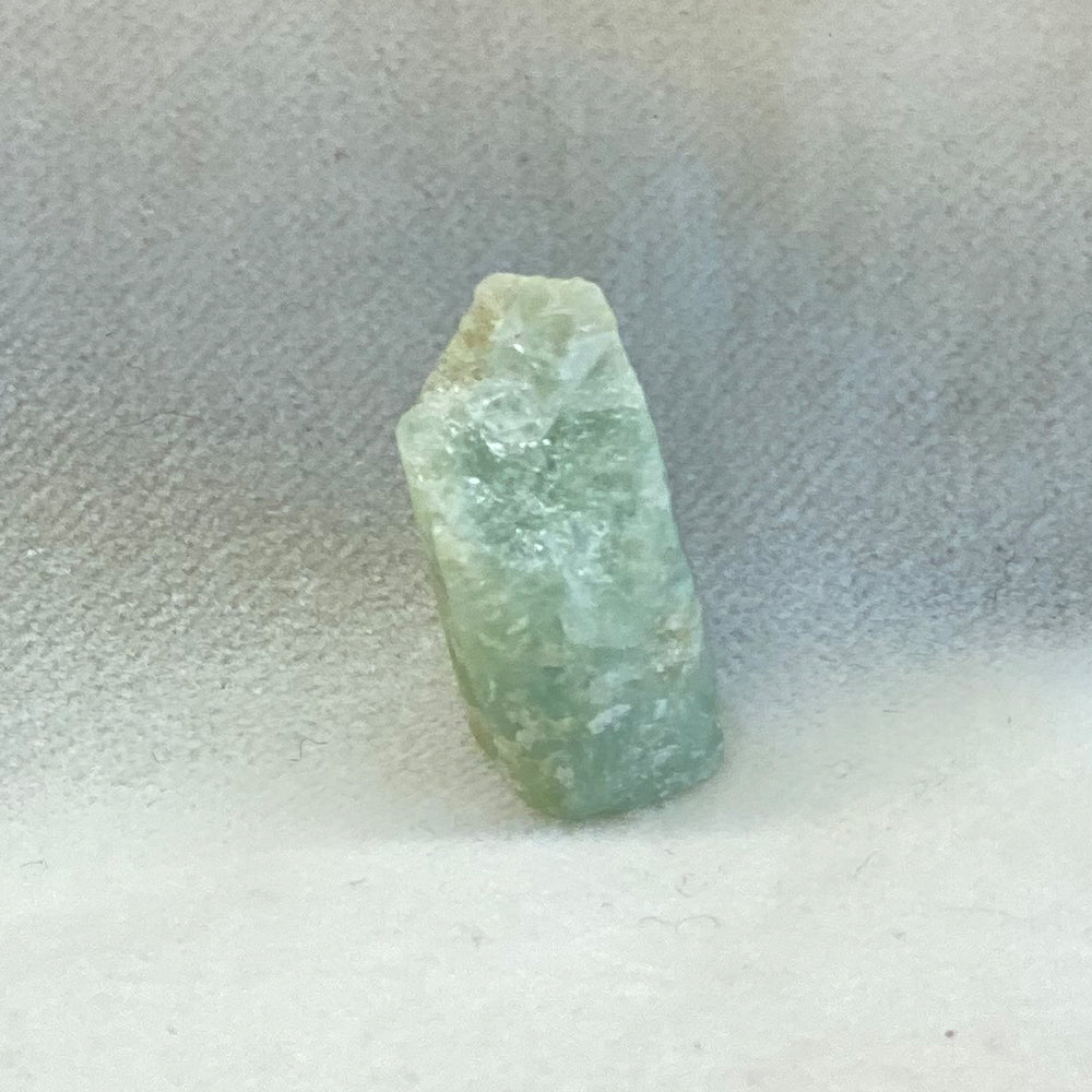 Small Aquamarine Stones with light-catching, crystalized structure and variable green/blue color.  Aquamarine is from Brazil.  Size approx 1 - 1.25 inches.  Aquamarine is said to be a calming water stone that brings peace of mind and happiness.