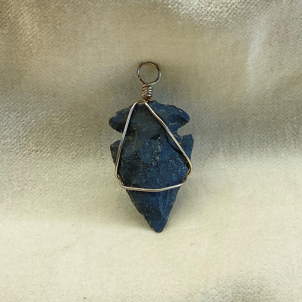 Handcrafted Arrowhead Pendant.  Stainless steel wire wrap with loop for cord.  Size: approx. 1 inch.