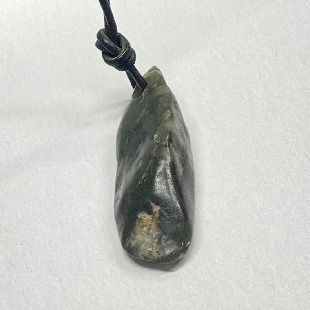  Big Sur Monterey Jade Pebble Pendant.  Pebble as found on the beach, then drilled for the cord. Over an inch in size. Big Sur CA is the only place that has an undersea jade deposit.  