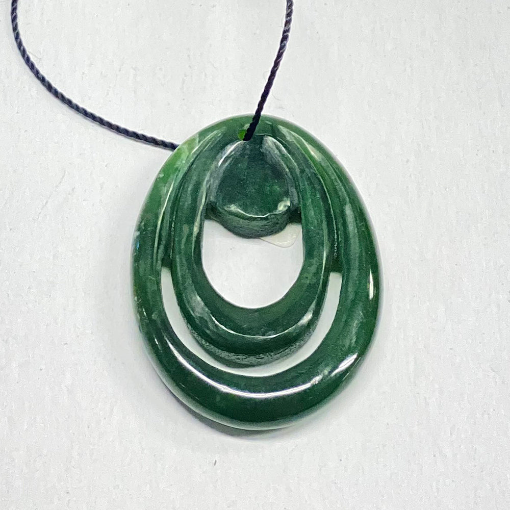 Fine British Columbia Jade Pendant.  Beautiful green color.  Superb polish and design in this hand carved pendant. Traded for this with a traveling artist that does excellent work.