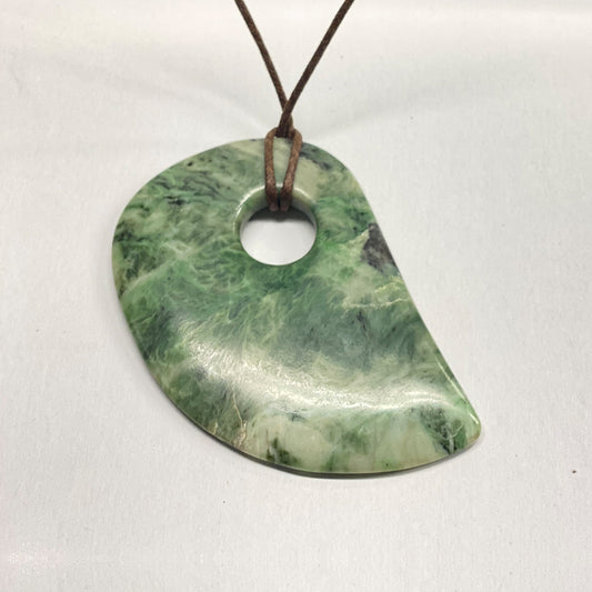 Mendocino California Jade Adze Pendant.  Stylized adze piece that makes a statement whenever and wherever you wear it.   Expertly made in Mendocino CA, known for great quality jade.  4 inches long and just under 3 inches wide.
