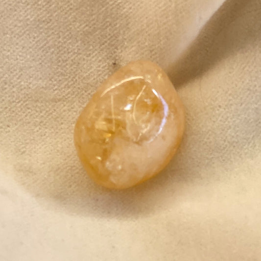 Tumbled Citrine small stone with translucent orange/yellow color.   Size is approx 1 inch.  Citrine is said to bring prosperity.