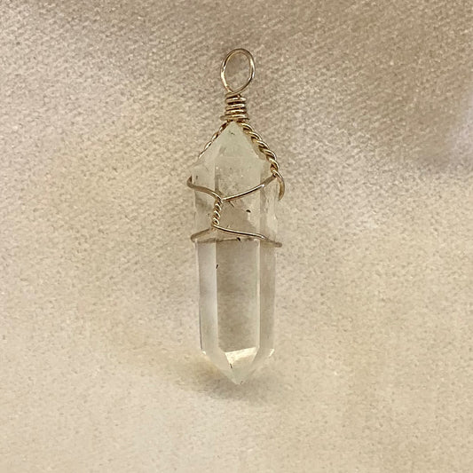 Nice double terminated cut and polished quartz crystal with handcrafted wire wrapping.   About 1.5 inches long with wire wrap.