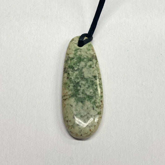Free Form RiverBlossom Jade Pendant.  A simple design using top quality jade and polished to perfection.  The jade used in this one of a kind piece was sourced from our helicopter trips to our private property in the Trinity Alps area in California.   We call this "RiverBlossom Jade," as the winter storms create high water that delivers the jade for us to simply pick up as the water recedes in the summer.  The pictured piece is exactly the piece you will receive.