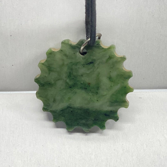Covelo California Jade Sun.   Sun shaped pendant with the horizon in the jade itself.  1.75 inch diameter.